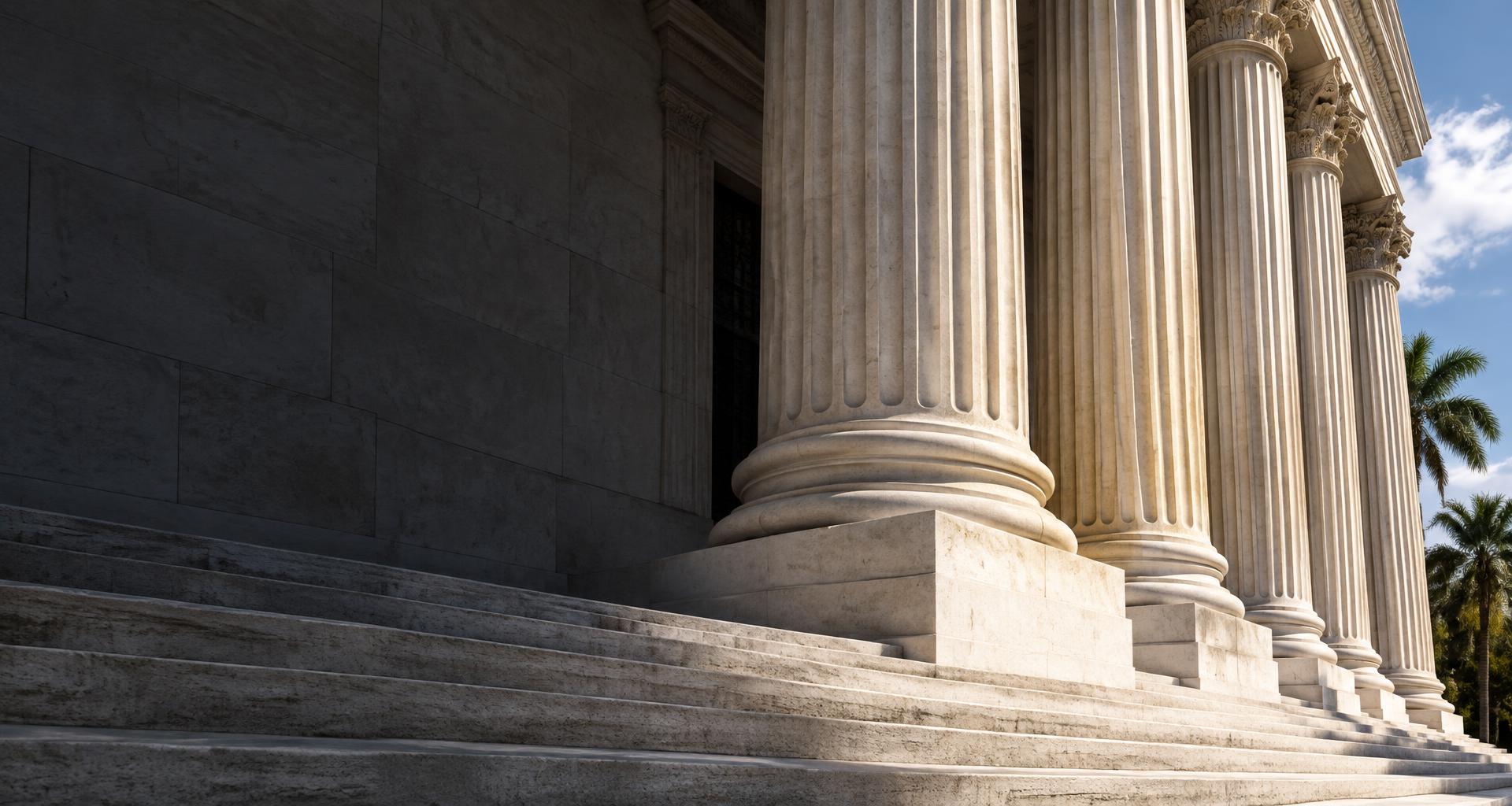 Sunlit stone courthouse columns